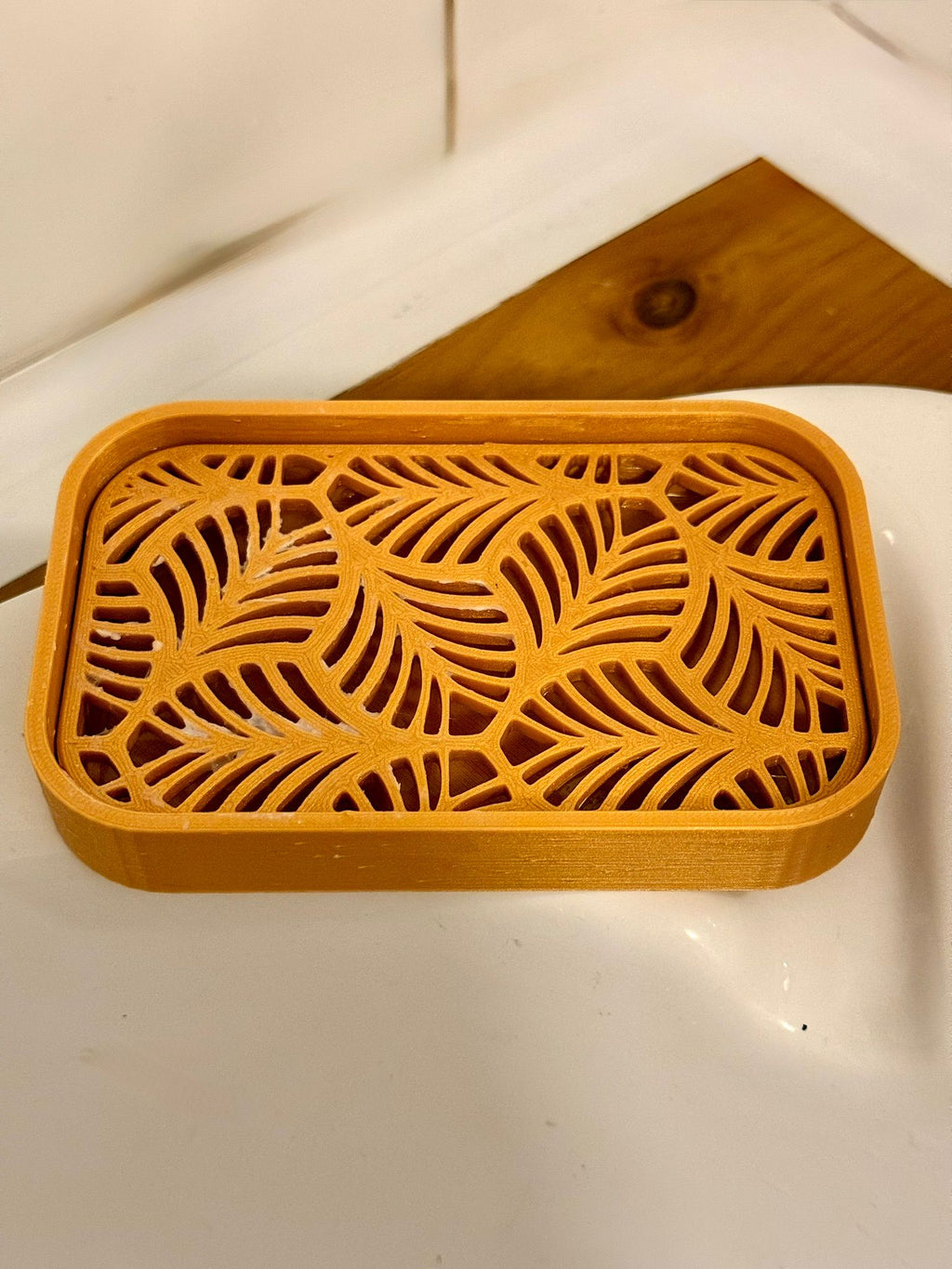 3D printed bathroom soap dish in beige with drainage channels